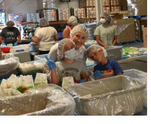 Family of volunteers at packing event